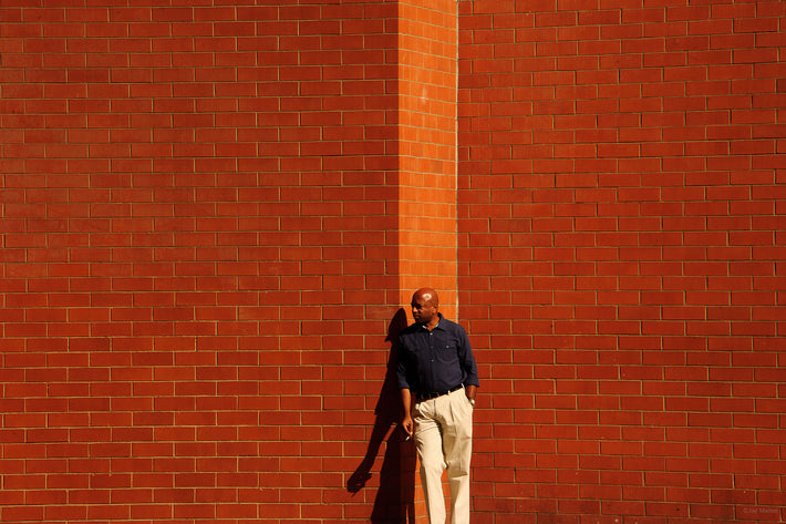 Man and Brick Wall, NYC