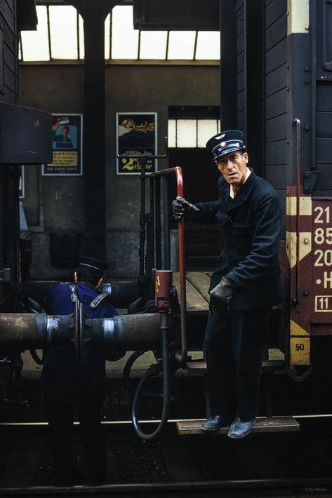 Worker Between Cars, Geneva