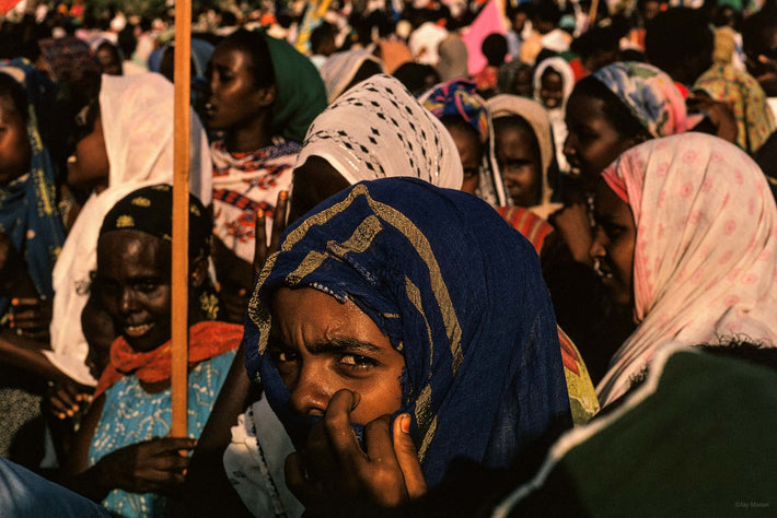 Woman in Crowd, Hand to Face, Somalia