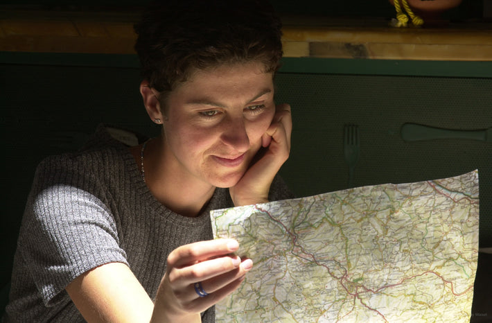 Woman Looking at Map, Unknown Locale, Italy