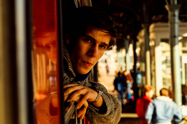 Young Man Looking Out of Train Window, Pisa, Italy