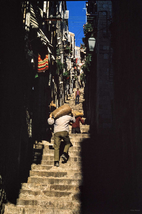 Man Carrying Sack Up Narrow Street, Dubrovnik