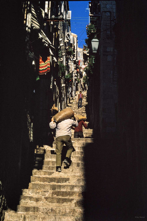 Man Carrying Sack Up Narrow Street, Dubrovnik