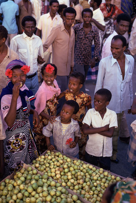 Children and Adults with Bin of Fruit, Somalia