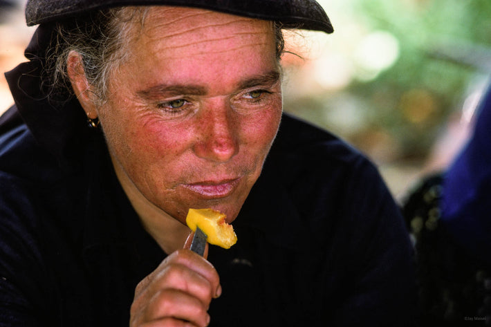 Woman with Food on Knife, Portugal