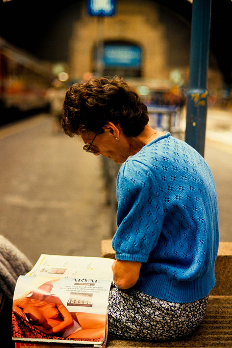 Woman with Picture of Nude in Magazine, Milan