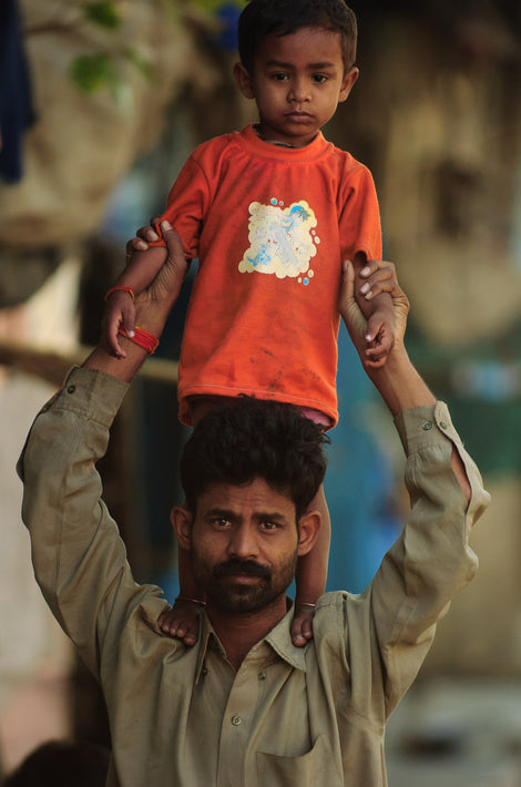 Child on Mans Shoulder&apos;s, Mumbai