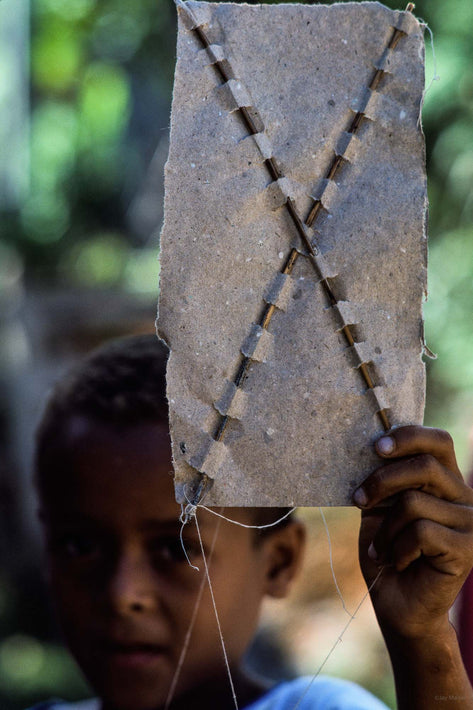 Boy Holding Up Homemade Kite