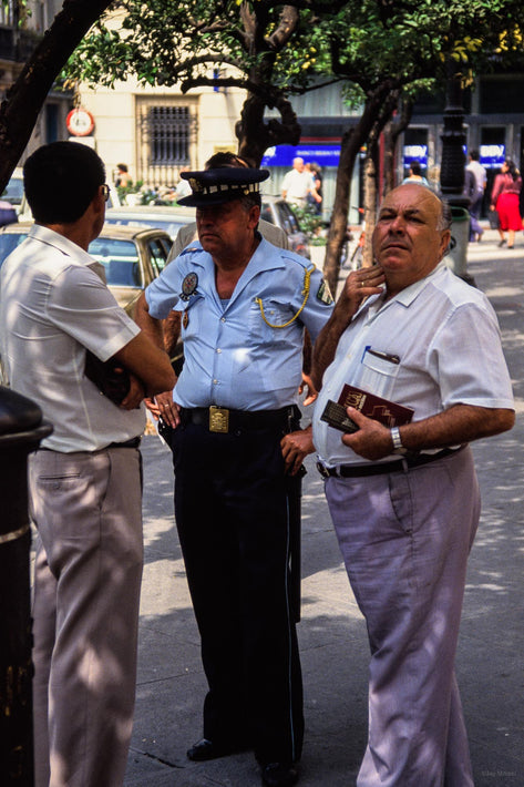 Three Men Talking, One Looking Away, Spain