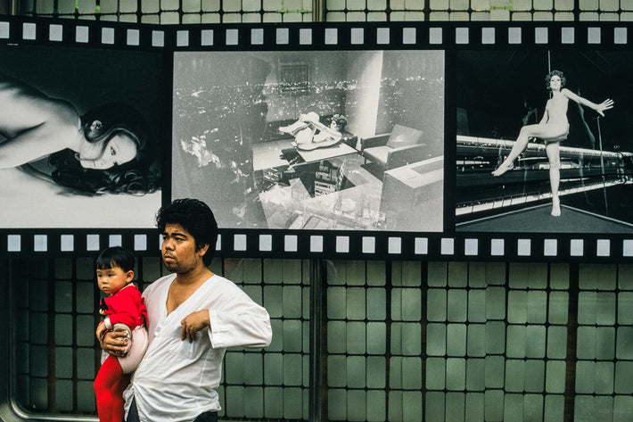 Man, Baby in Red, Photos on Wall, Tokyo