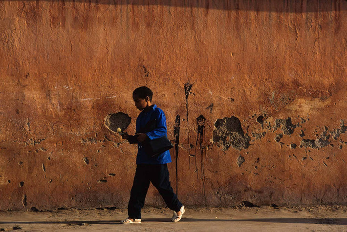 Boy in Blue with White Object, Marrakech