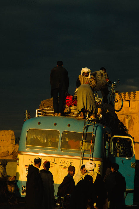 Bus with Silhouetted Men with Men on Top, Marrakech