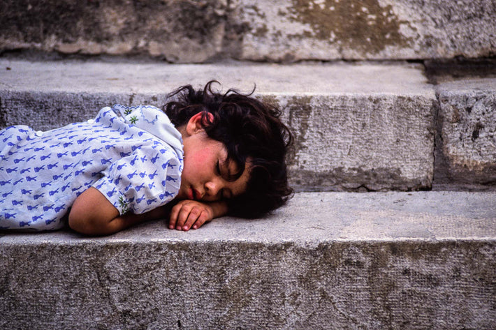 Child asleep on Steps, Spain