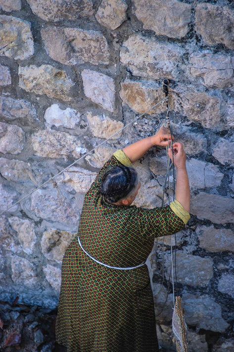 Woman Tying String, Dubrovnik