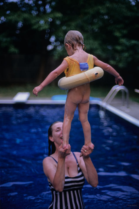 Standing on Mom's Hands in Pool