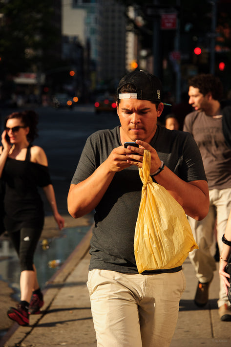 Intent on Cell Phone, Yellow Bag, NYC
