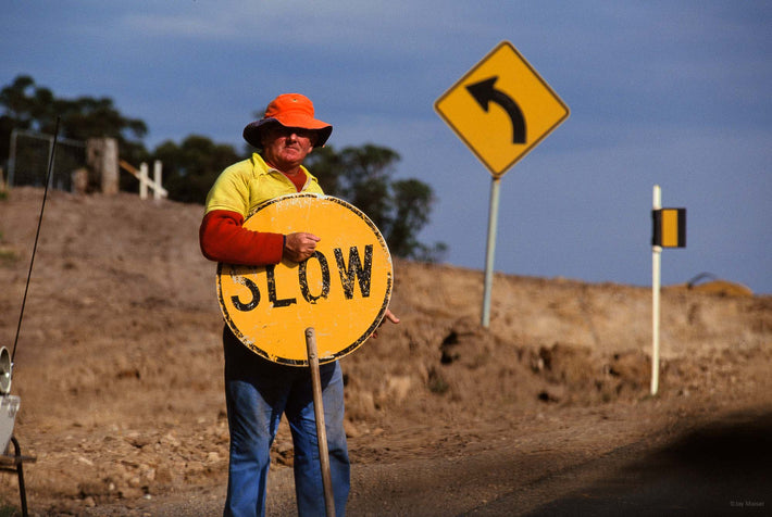 Man with Traffic Sign, "Slow", Australia