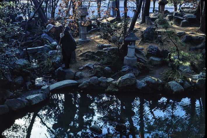 Man in Gloves Tending Garden, Japan