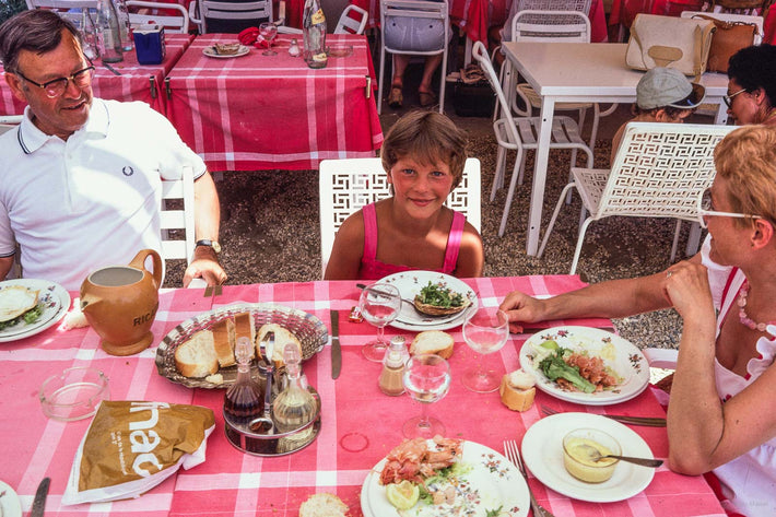 Family at Table, Parents Looking at Daughter, France