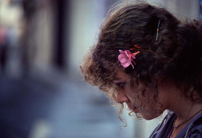 Close-Up of Woman Reading at Table, France