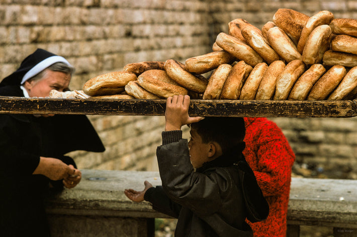 Arabic Boy Selling Bread to Nun, Jerusalem