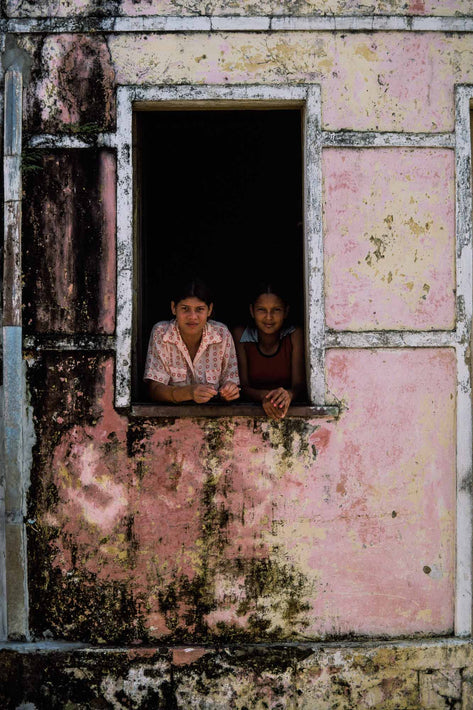 Two Girls in Window, Textured Outer Wall, Bahia