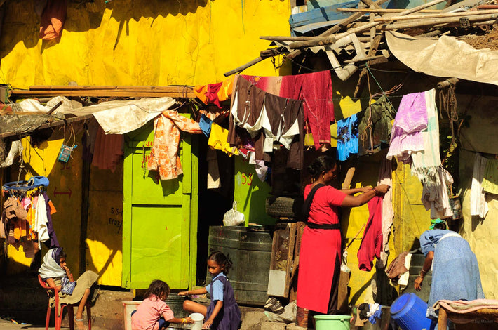 Woman in Red Against House with  Laundry, Mumbai