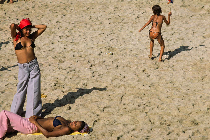 Three on Beach, One Adjusting Scarf, One with Toy, Bahia