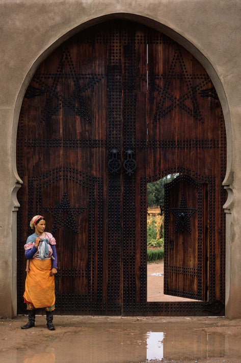 Woman with Baby's Leg Against Huge Door, Marrakech