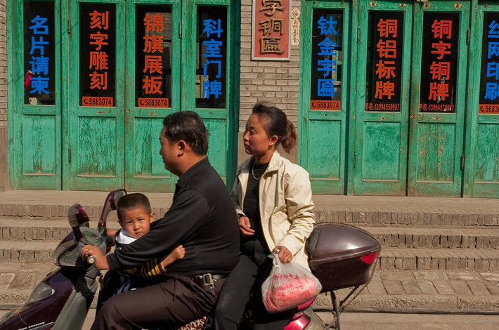 Three on Motor Scooter
