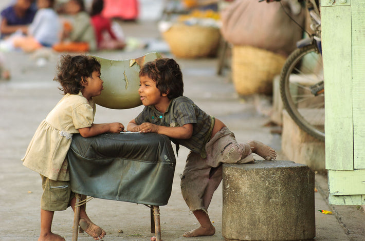 Two Young Children Talking Over Chair, Mumbai
