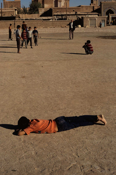 Boy Laying on Ground, Iran