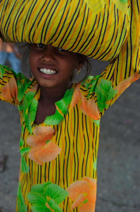 Girl Carrying Yellow Sack on Head, Mumbai