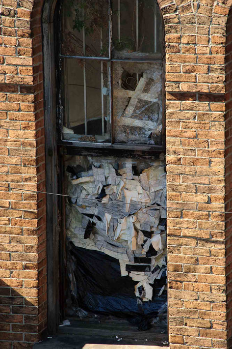 Window Stuffed with Paper, NYC