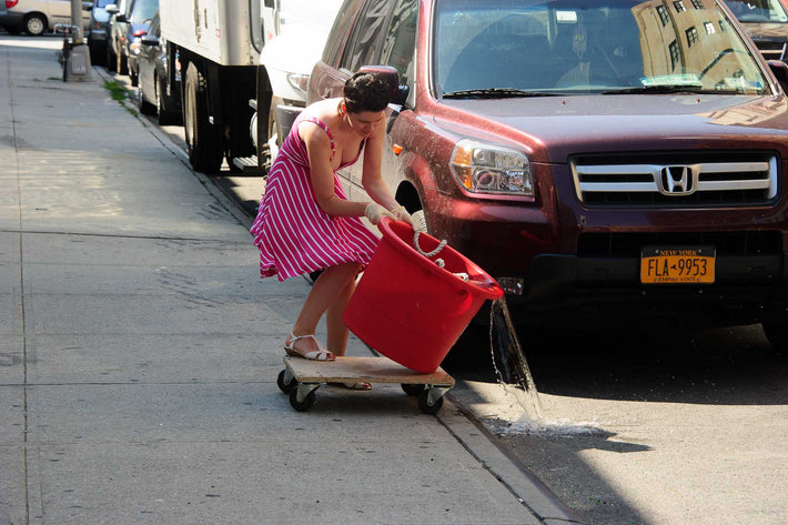 Woman Emptying Water, NYC