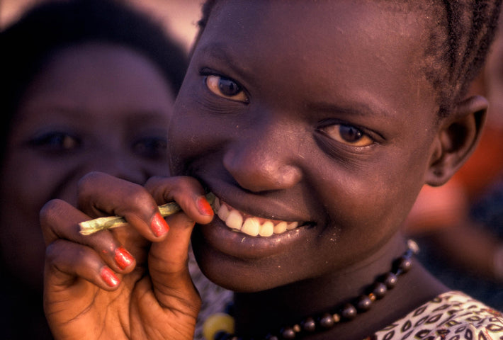 Smiling Girl with Sugar Cane, Senegal