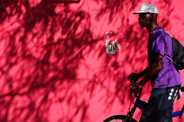 Man, Bike, Pinkish Wall, NYC