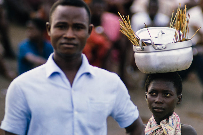 Girl with Pot on Head, Looking at Man, Ghana