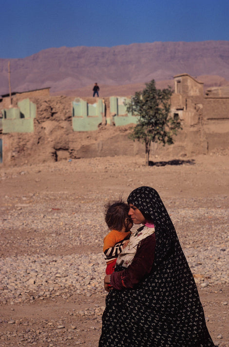 Woman and Child Outside with Mountains in Background