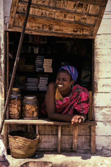 Woman in Store Window, Smiling, Somalia