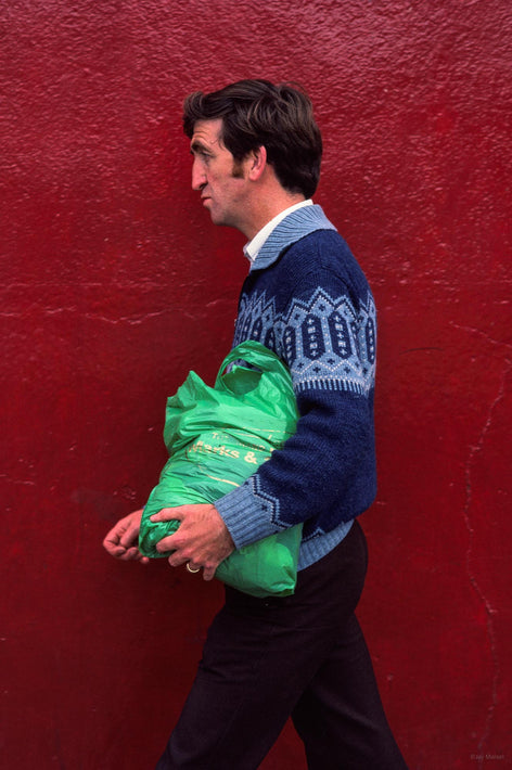 Red Wall, Man with Green Bag, Ireland