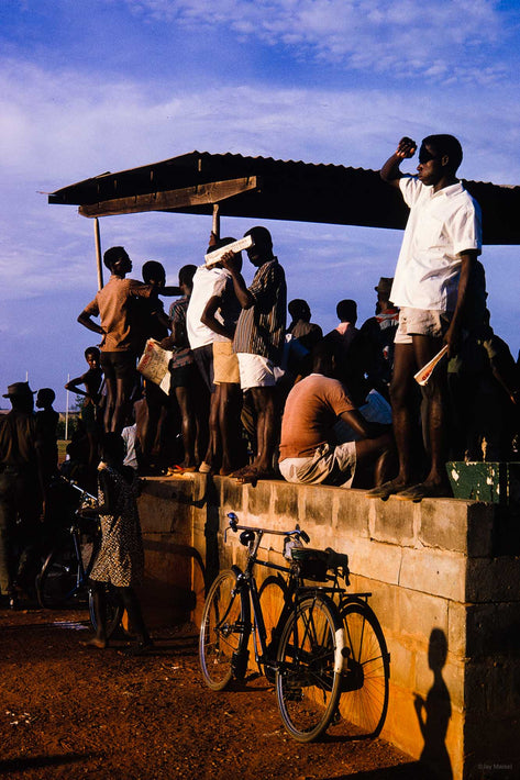 Man on Cart Shielding His Eyes, Ghana