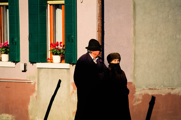 Two in Black Walking Against Wall, Burano