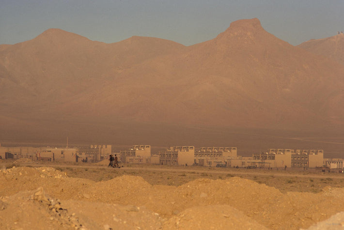 Desert Buildings and Mountains with Three Small Figures, Iran