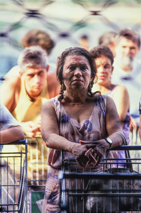 Woman with Shopping Cart Behind Fence, Rio de Janeiro