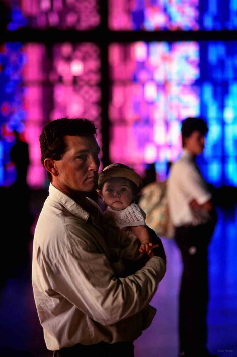 Man Holding Baby with Red and Blue Windows, Rio de Janeiro