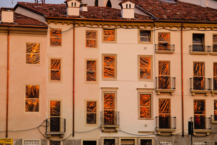 Building with Plastic on Windows Reflecting Sunset, Vicenza