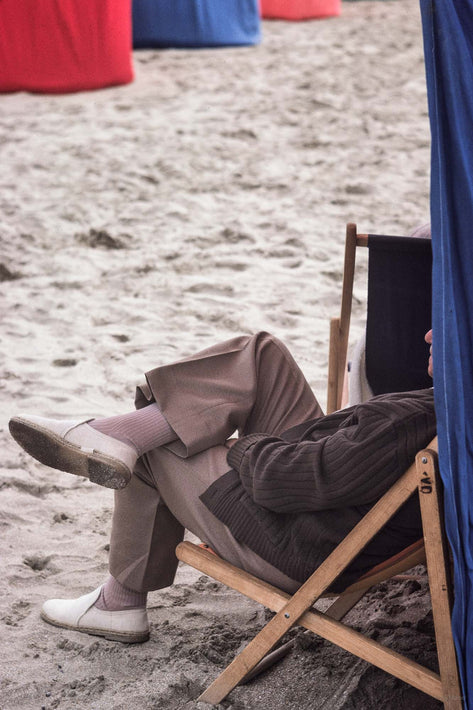 Fully Clothed Man at Beach in Chair