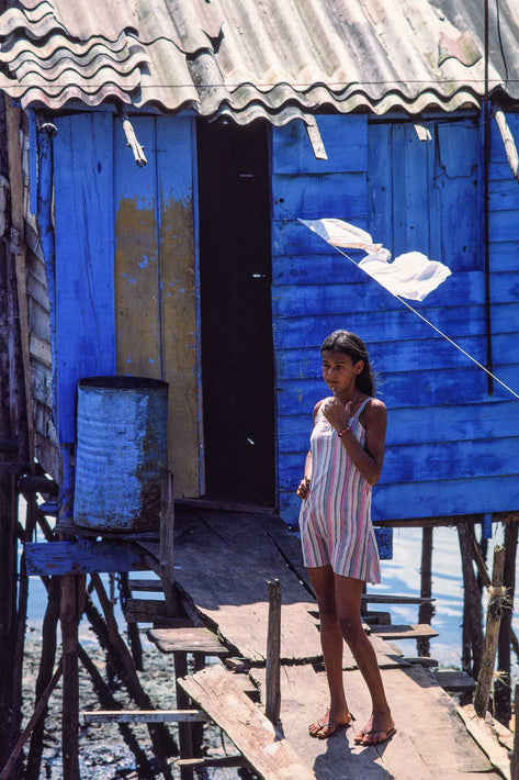 Young Girl, Striped Dress Against Blue Shack, Bahia