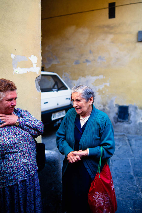 Two Women Talking, One Hand to Neck and One with Hands Clasped, Cortona